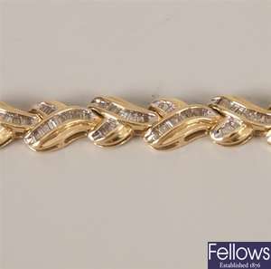 14K gold baguette diamond set bracelet, the links