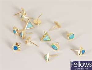 Seven pairs of 18ct gold opal set stud earrings
