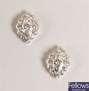 Pair of lozenge shaped diamond cluster stud