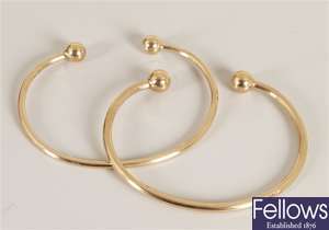 Two 9ct gold torque bangles. Total weight - 22.6