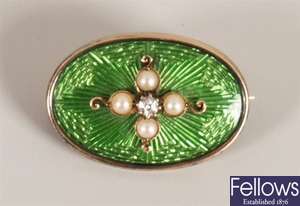 An oval diamond and seed pearl set brooch, with a