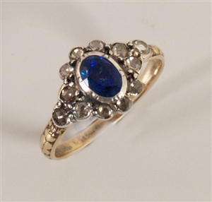 Sapphire and diamond cluster ring with a central