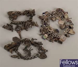 Three silver curb link charm bracelets, charms to
