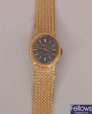A ladies recent 18k gold Sakata wrist watch the