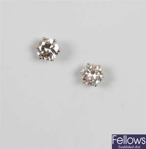 Pair of single stone diamond stud earrings with