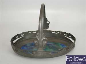 A Tudric English pewter oval basket, the looped
