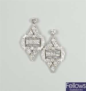 18ct white gold diamond dropper earrings with a