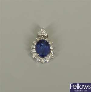 A tanzanite and diamond cluster pendant, with a