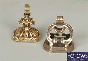 Two fobs, to include an ornate design fob, with