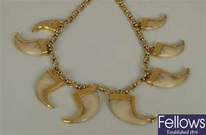 A tiger claw necklace, in the design of a
