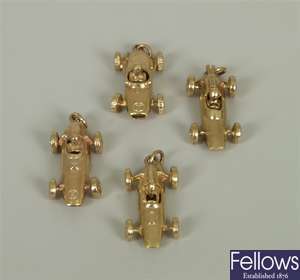 Four 9ct gold 1960's grand prix racing car charms