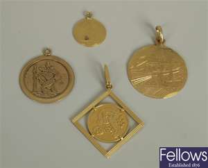 Three pendants, to include a circular St