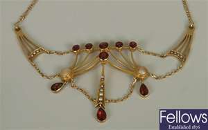 An early 20th century ornate garnet and split