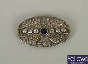 Sapphire and diamond oval brooch with a central
