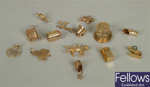 Sixteen assorted 9ct gold charms and pendants to