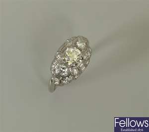 Platinum diamond cluster ring with a central