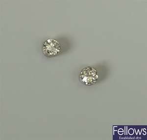 Pair of single stone diamond stud earrings set