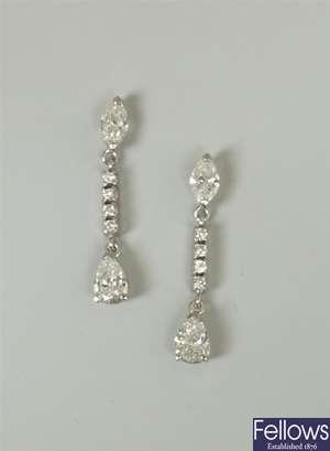 A pair of diamond dropper earrings, with a