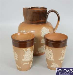 A Doulton Lambeth stoneware jug, the brown glazed