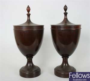 A pair of 19th century turned mahogany urns and