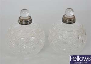 A pair of globular cut glass scent bottles with