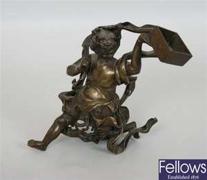A Japanese bronze figure modelled as a demon,