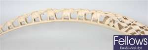 A carved ivory elephants tusk with procession of