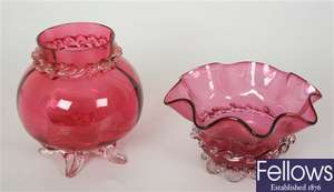 A cranberry and clear glass vase of bulbous form,