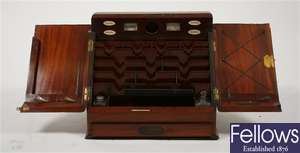 A good late 19th century mahogany twin door desk