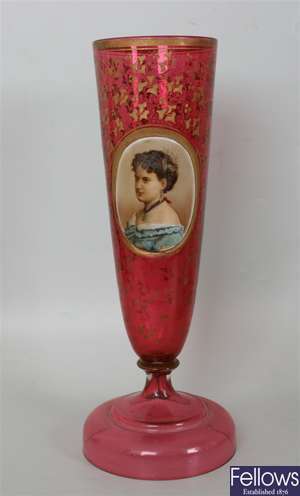 A 19th century cranberry glass vase of flared
