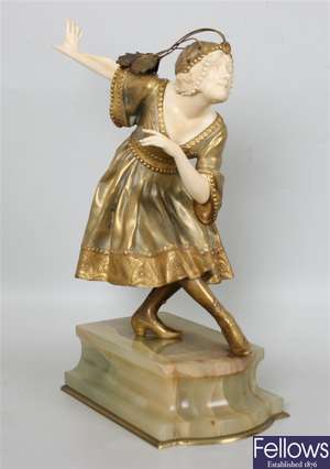 An early 20th century gilt bronze and ivory
