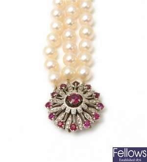 A three row cultured pearl necklet on a cluster