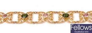 An ornate pink and green tourmaline bracelet,