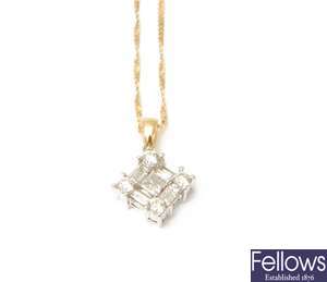 A diamond cluster pendant with a central princess