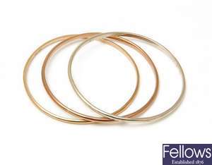 Three 9ct gold different coloured bangles of