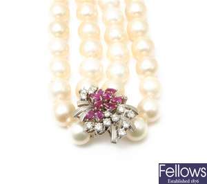 A two row uniform cultured pearl necklet on a