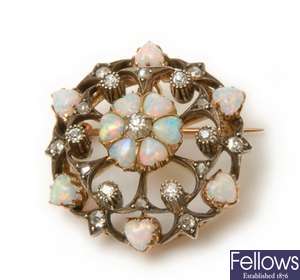 An Edwardian ornate opal and diamond circular