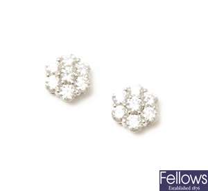 A pair of 18ct white gold seven stone diamond
