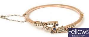 An early 20th century 9ct gold bangle with a