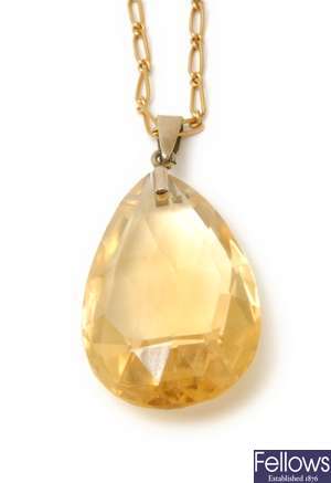A pear shape faceted citrine pendant on a fetter