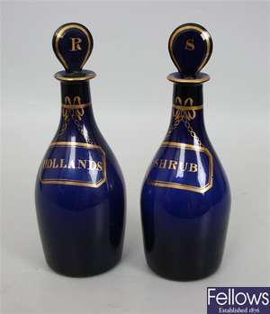 A pair of Bristol blue, bottle shaped decanters
