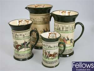 A set of four graduated Royal Doulton jugs, each