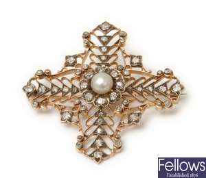 A continental diamond set cross shaped brooch,