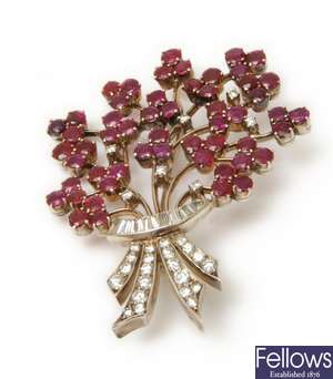 A ruby and diamond set floral spray brooch, with