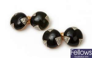 A pair of cabochon onyx round cuff links each