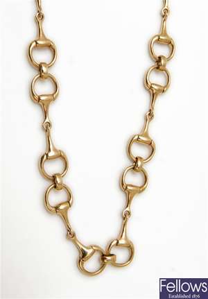 A 9ct gold horses snaffle bit necklace,
