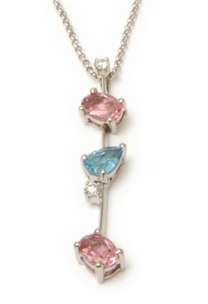 An 18ct white gold diamond, blue topaz and pink