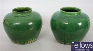A pair of 19th century green glazed oriental