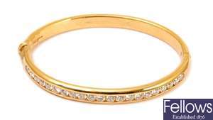 An 18ct yellow gold  diamond set hinged bangle