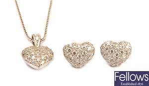 A pair of pave set set diamond heart shape stud